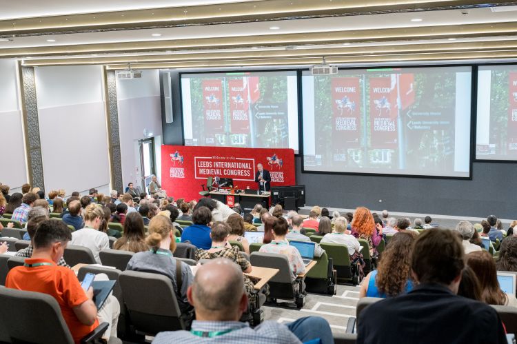 A full lecture theatre of delegates at the International Medieval Congress listening to a keynote lecture