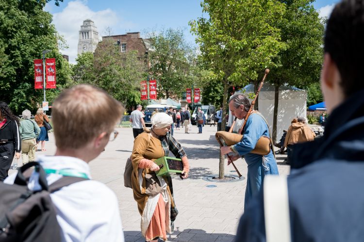 Re-enactors playing medieval musical instruments