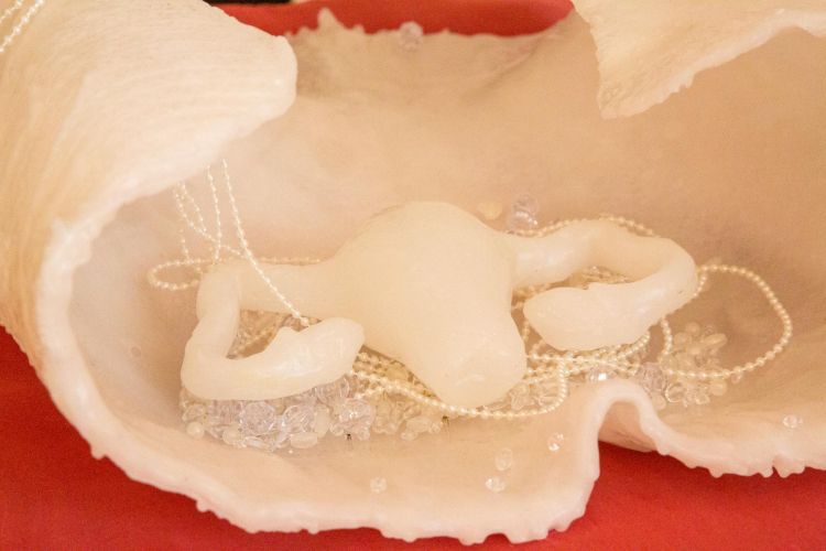 Artwork created with wax and pearls