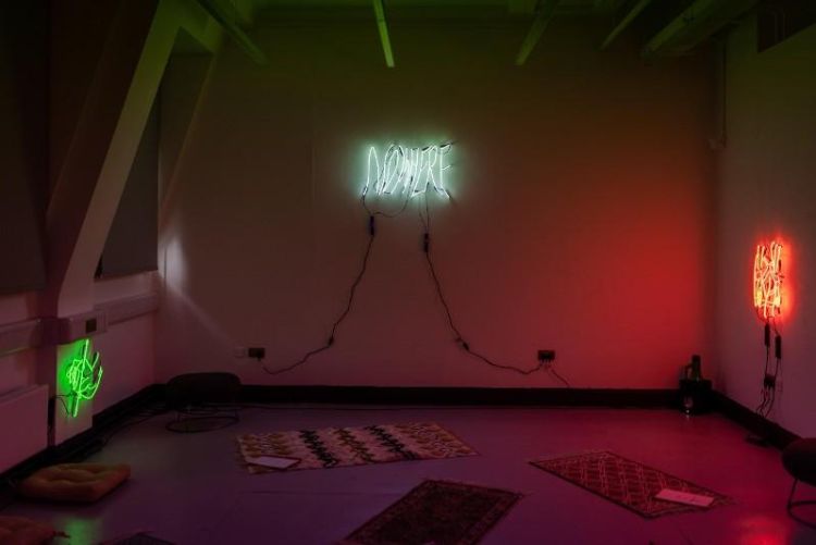 Photo of neon wall sculptures in a gallery space