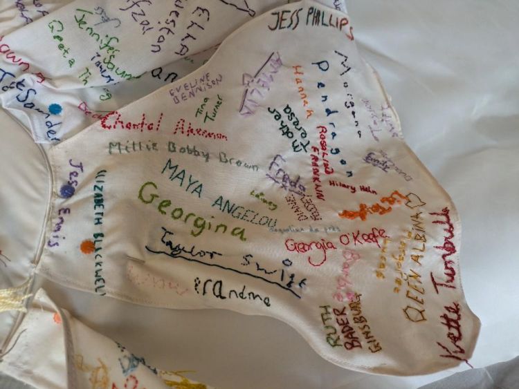 Embroidered names on a piece of material