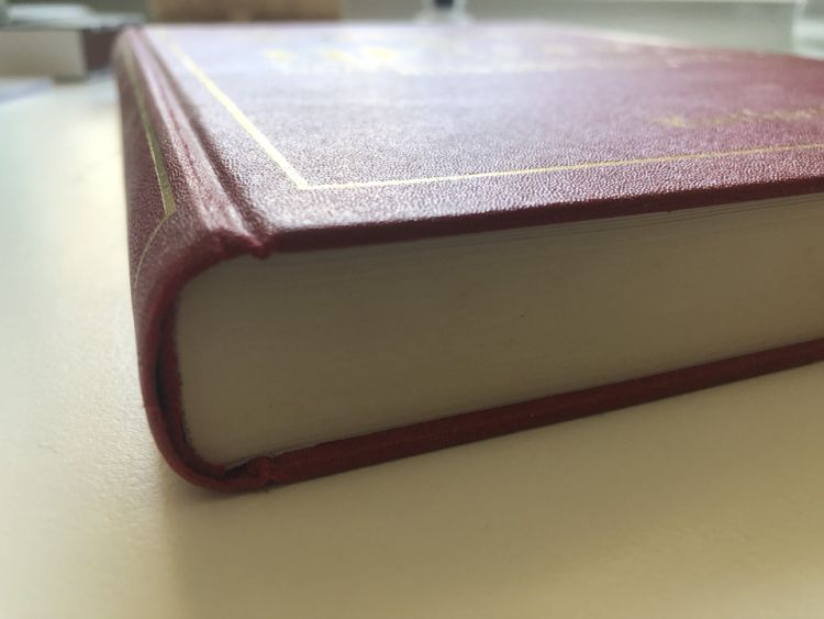 hardbound book on a desk