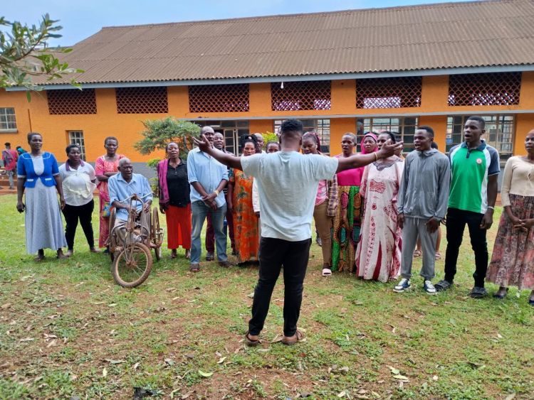 Choir outside a community centre.
