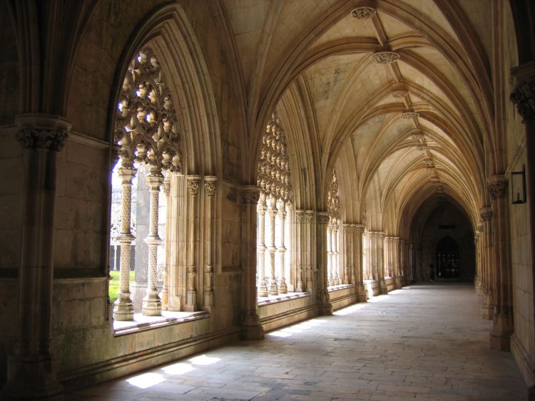 A cloister in a church, shrouded in shadow