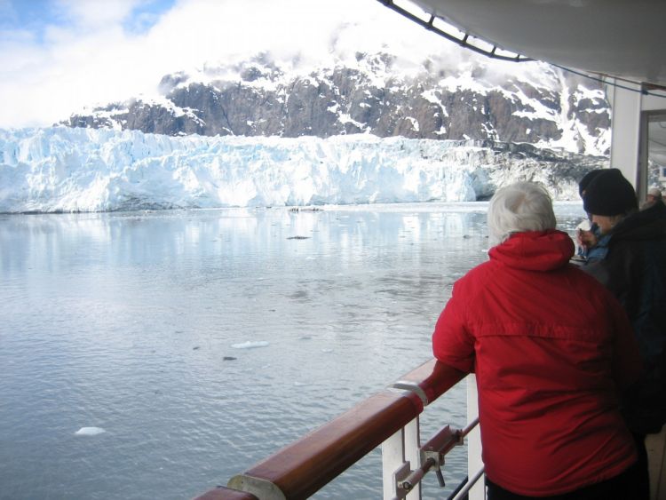Passengers on an Arctic cruise look at icy glaciers