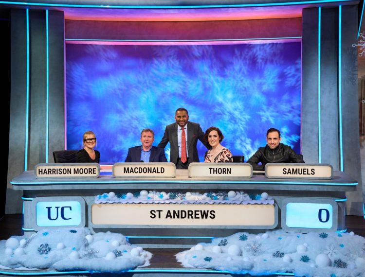 Team of four contestants for Christmas University Challenge with presenter.