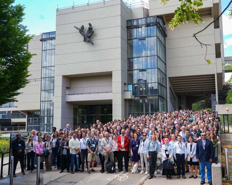 Attendees from the 11th EST stand together for a group photo outside the University of Leeds