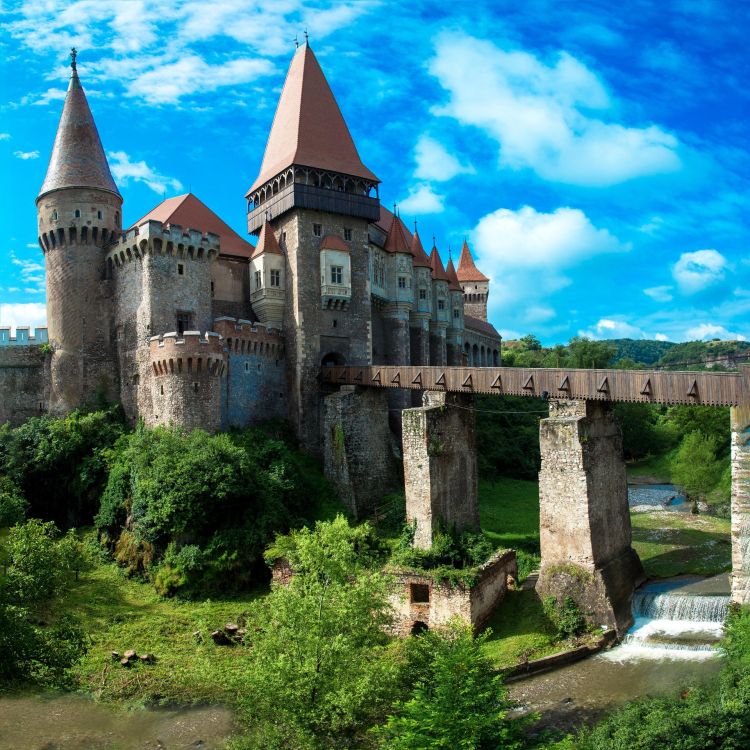 A Castle in Transylvania with bright blue skies in the background