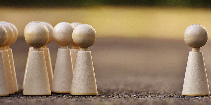 simple wooden figures that represent people