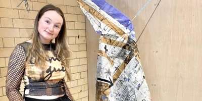 Artist Molly Newham standing next to a sculpture entitled Erosion Term II; Tension 2022)