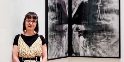 Exhibition curator and practice-led PhD student, Hondartza Fraga pictured in front of her work 'Saturn and Melancholy'.