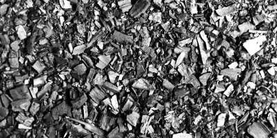 Close-up image of small pieces of charcoal. Copyright :Lucy Crouch.
