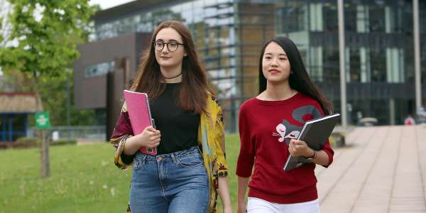 Students walking across University of Leeds campus